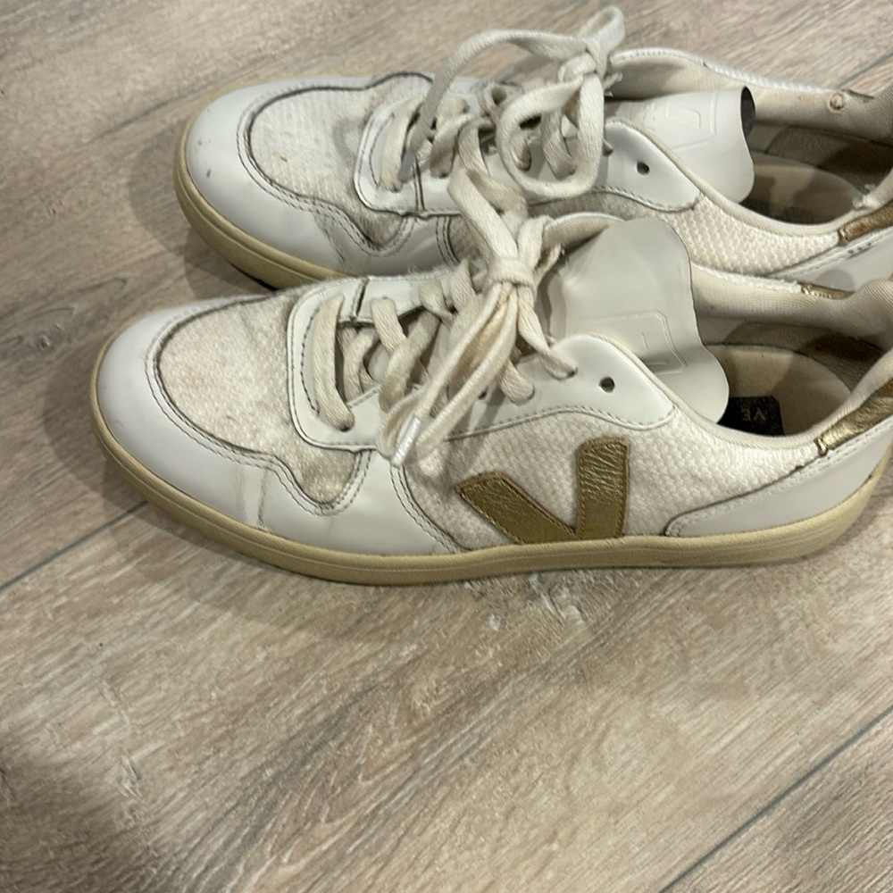 Veja white and gold sneakers